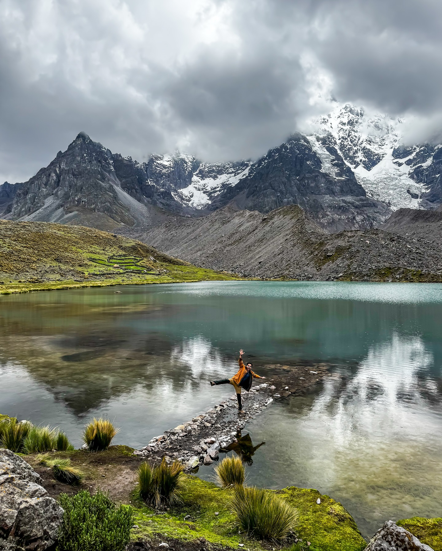 Snow-capped Ausangate peak reflecting in the water