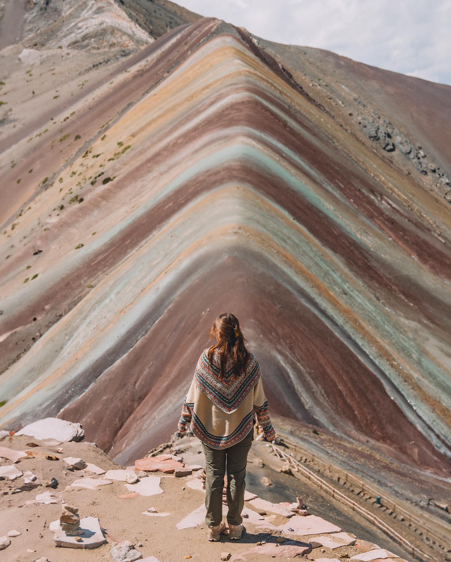 Tourists enjoying the summit of Rainbow Mountain